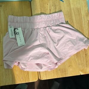 Aritzia Ascent golden shorts in Cupid Pink